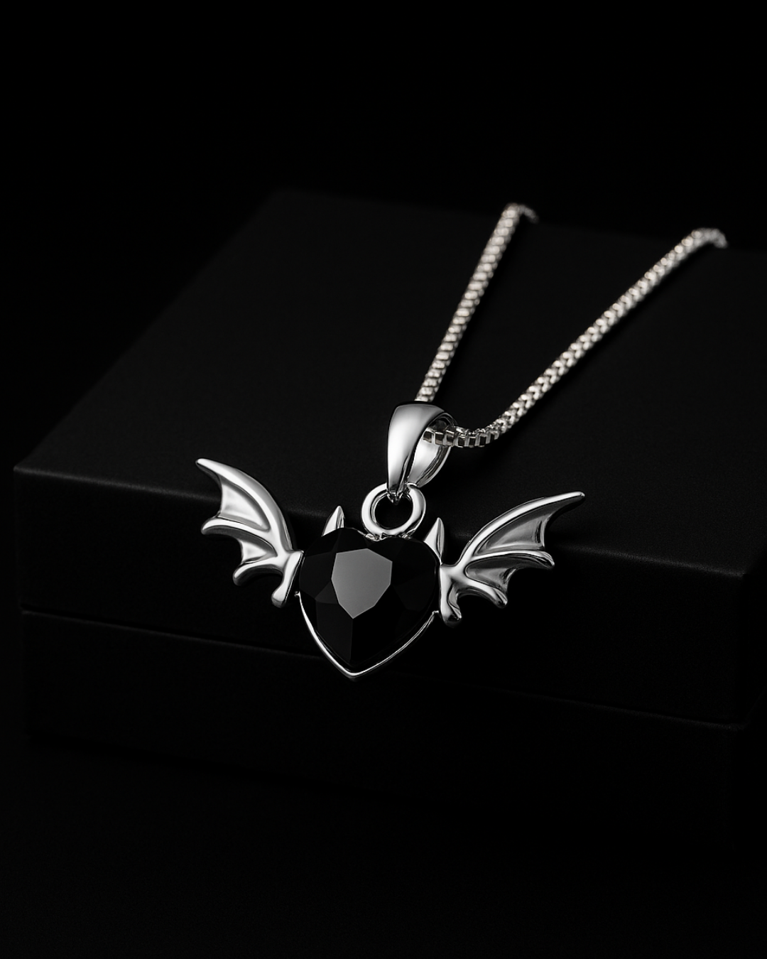 Blackdevil Heart Pendant with heart and wings design on a black background
