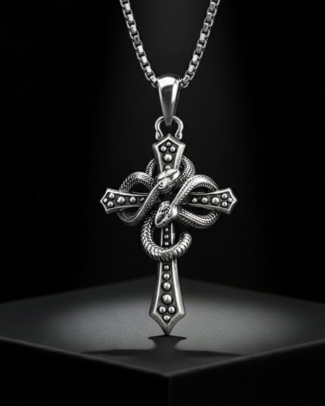 Alchemist's Cross Pendant with snake design on a dark background