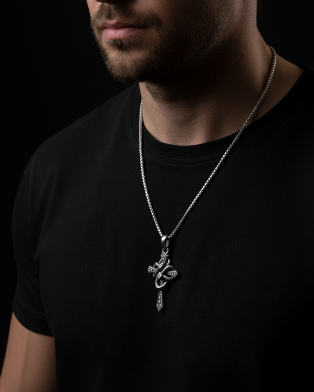 Man wearing a black shirt with a silver necklace featuring a Alchemist's Cross Pendant