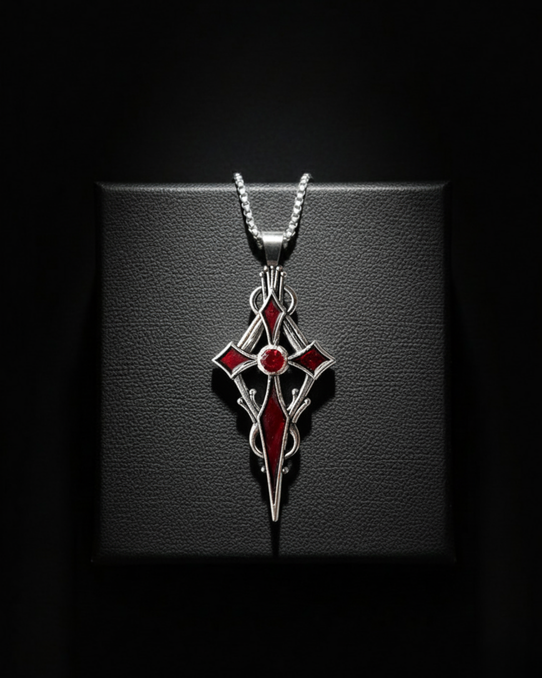 Crypt Bloom Pendant with red gemstone on a black background