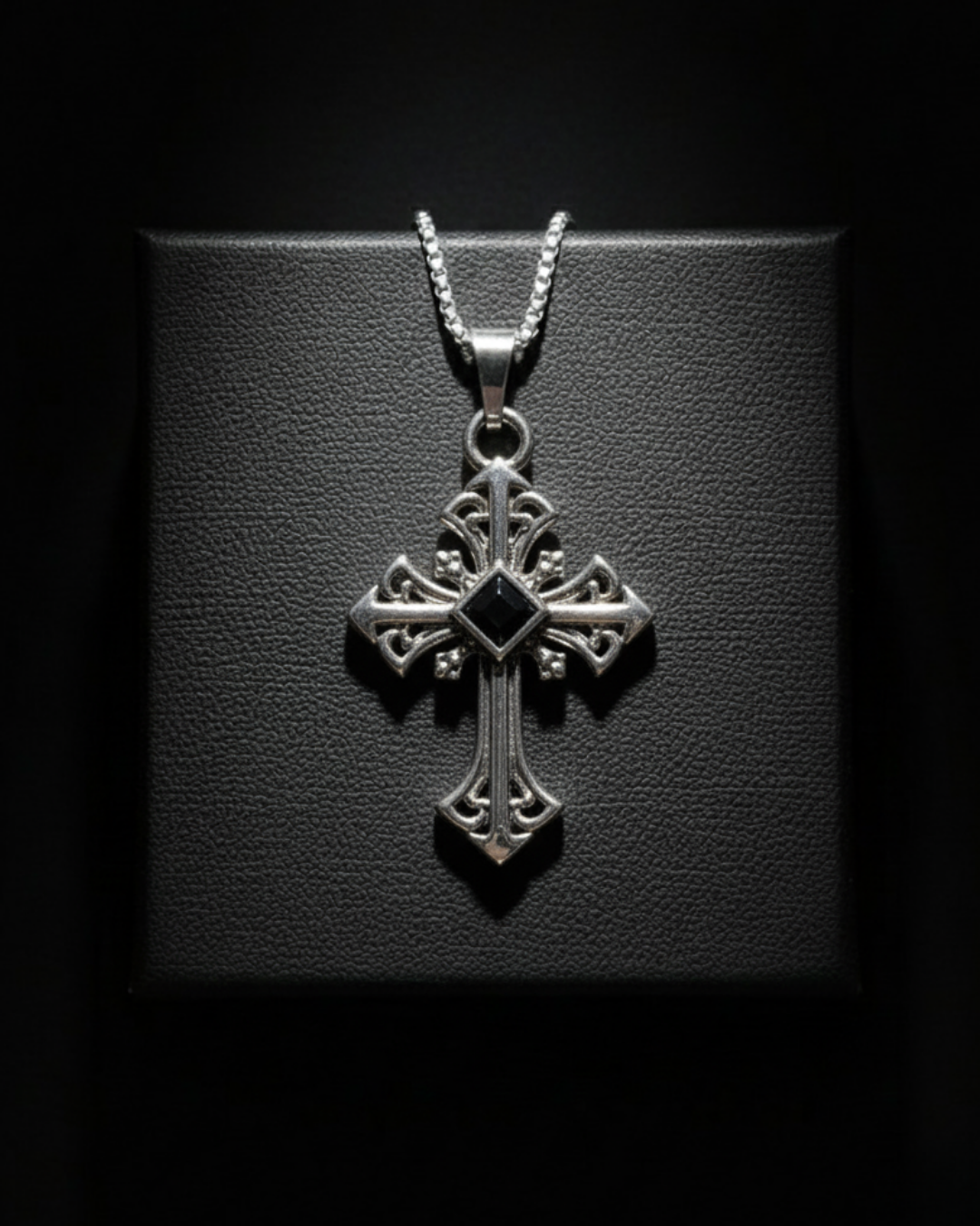 Darkstone Cross Pendant with a black gemstone on a dark background