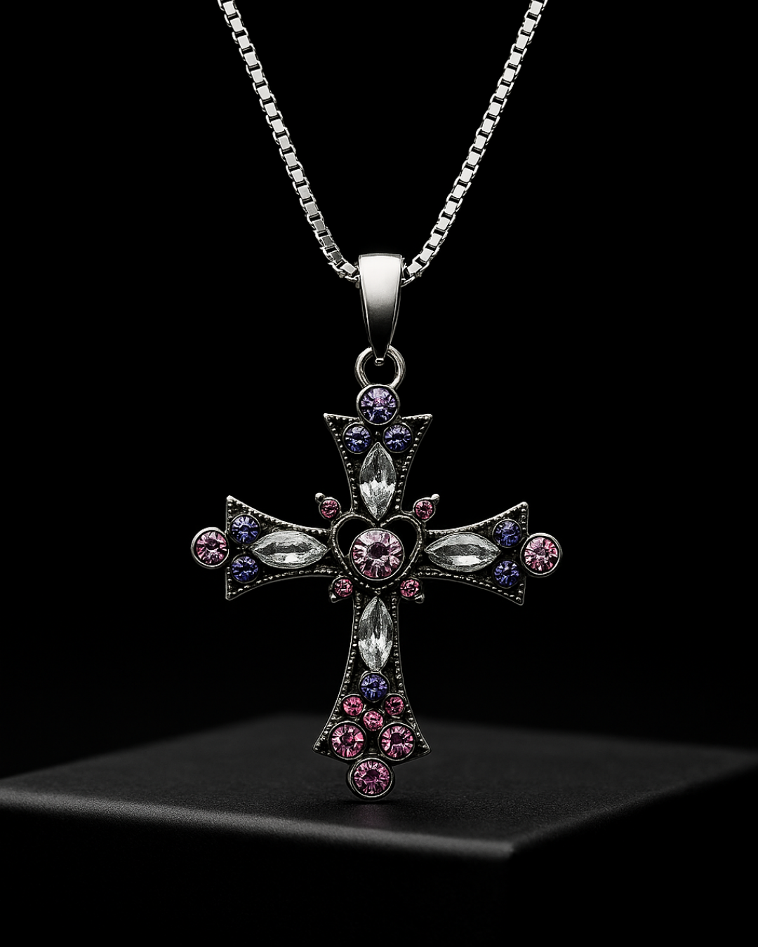 Gothic Nexa Cross Pendant with colorful stones on a black background
