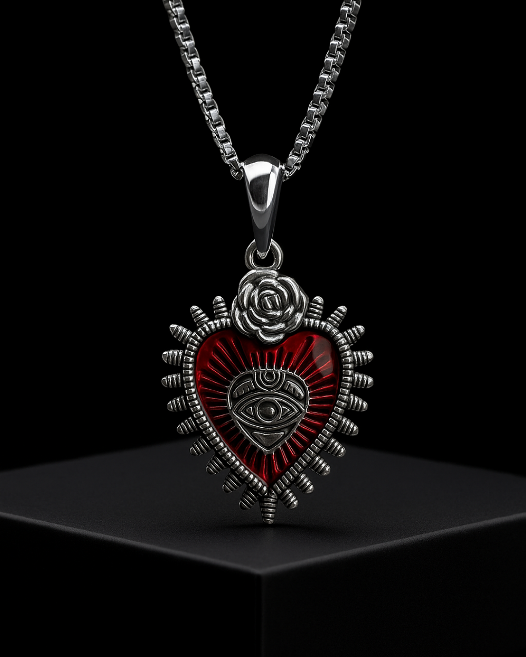 Illuminati Heart Pendant with rose and eye design on a black background