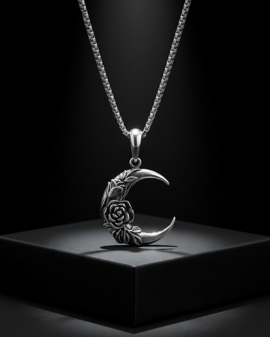 Silver Midnight Rosemoon Pendant with floral design on a black background