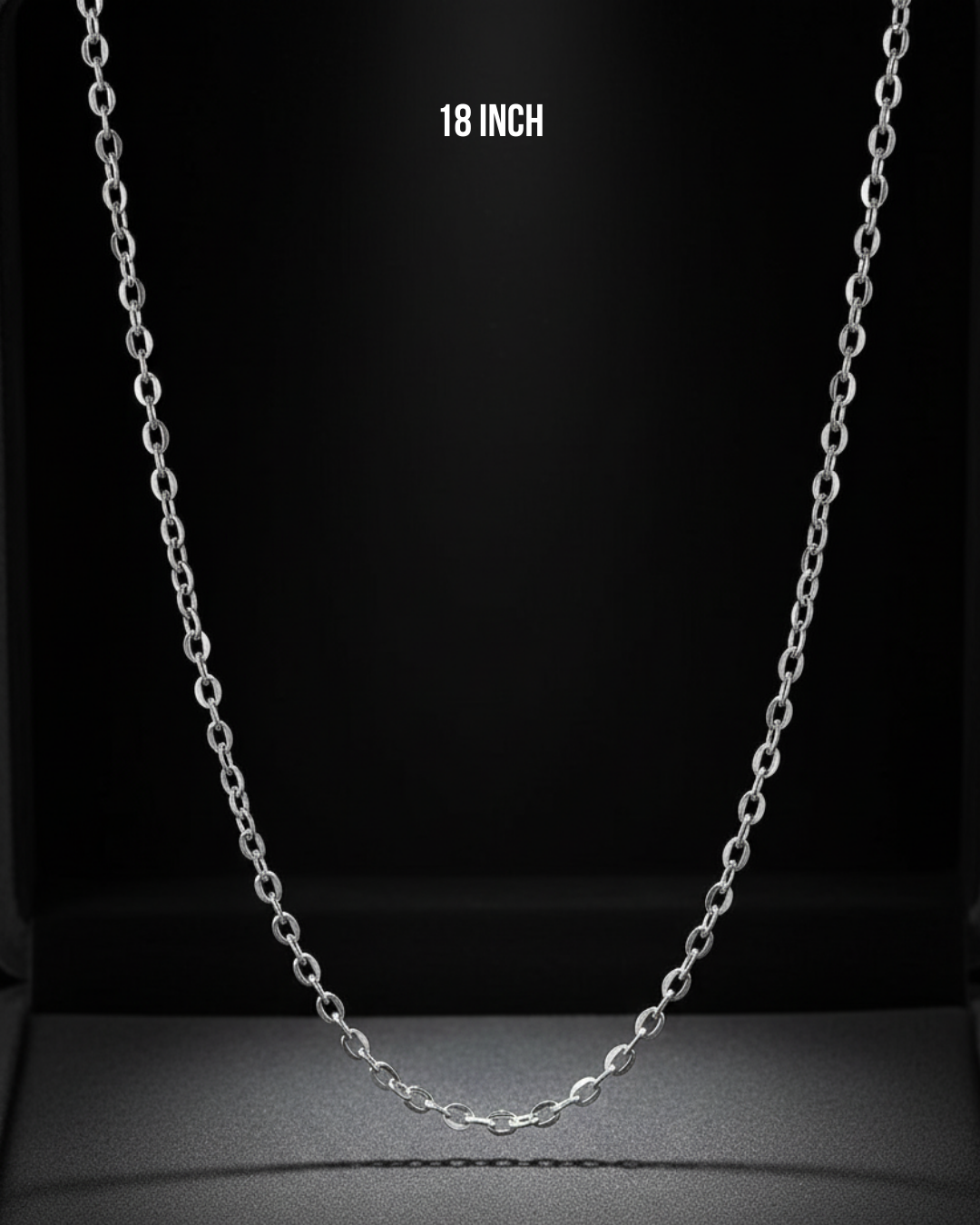 Silver chain necklace on a black background with '18 Inch' text.