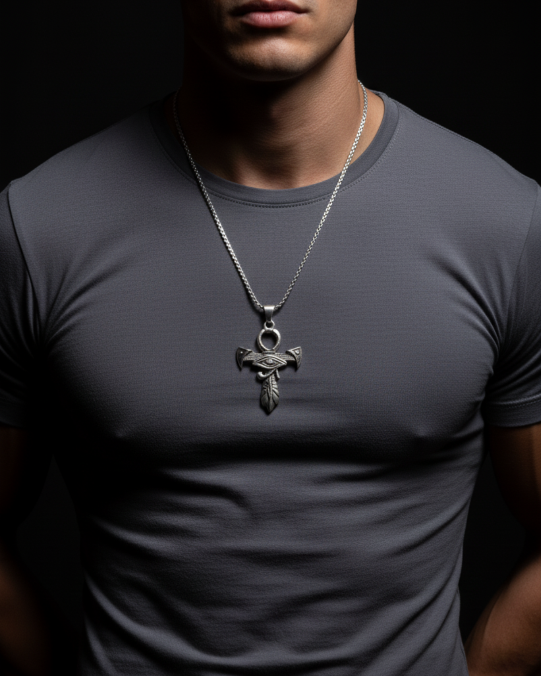 Man wearing a dark gray t-shirt with a Odin's Gaze featuring a pendant.