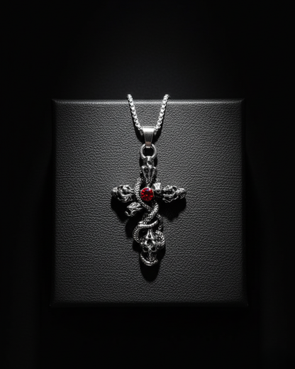 Skull Cross Pendant with a red gemstone on a dark background